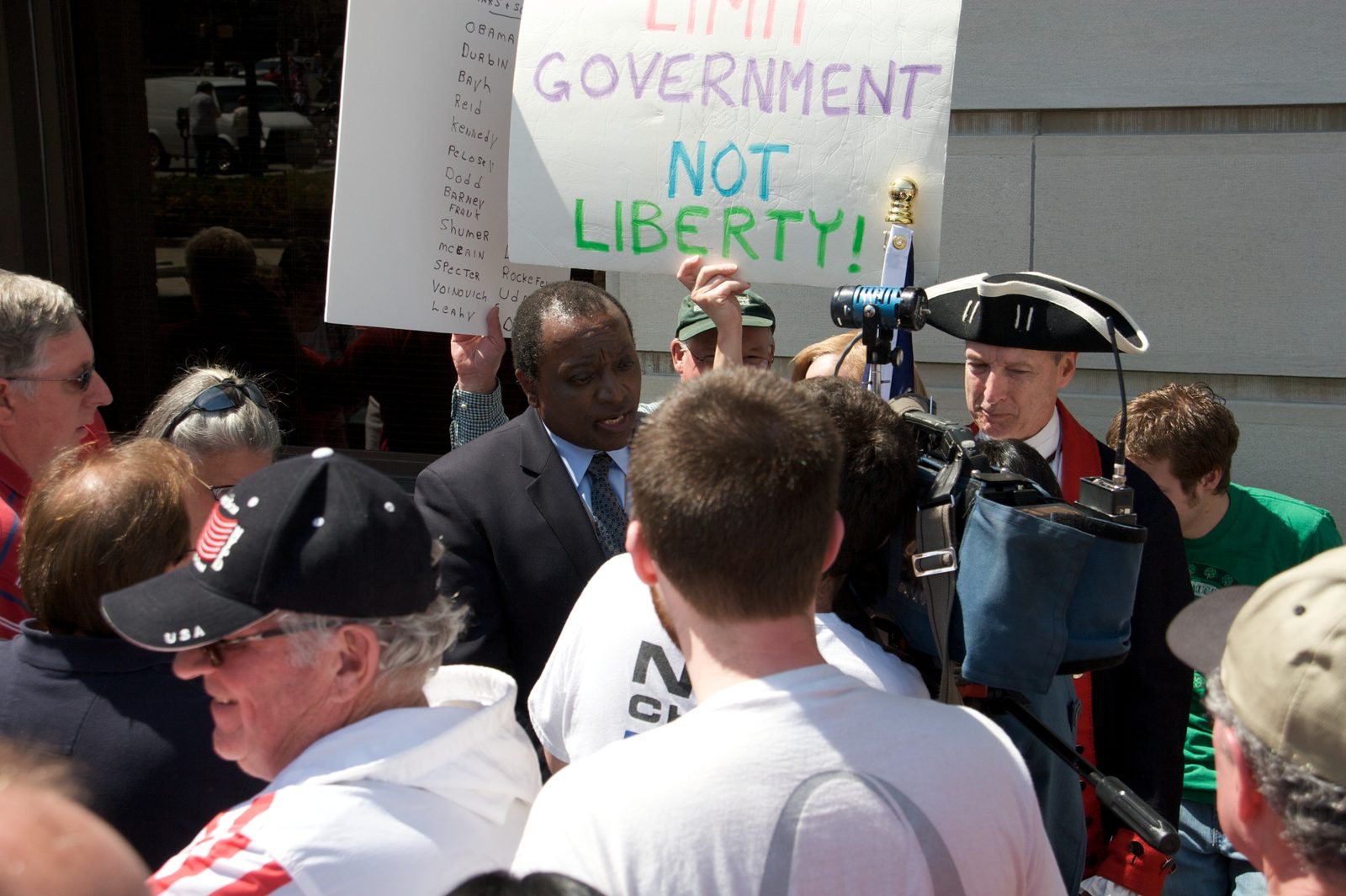 Alan Keyes giving a television interview inside a rally crowd, Fort Wayne, April 2009